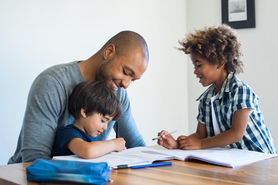 A father enjoys a visit with his children.